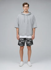 Full body view of the model wearing All-Over Print Unisex Athletic Long Shorts